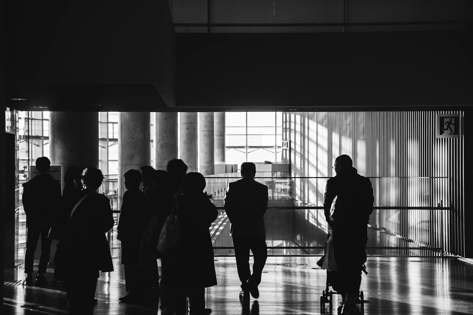 silhouette of people walking on hallway